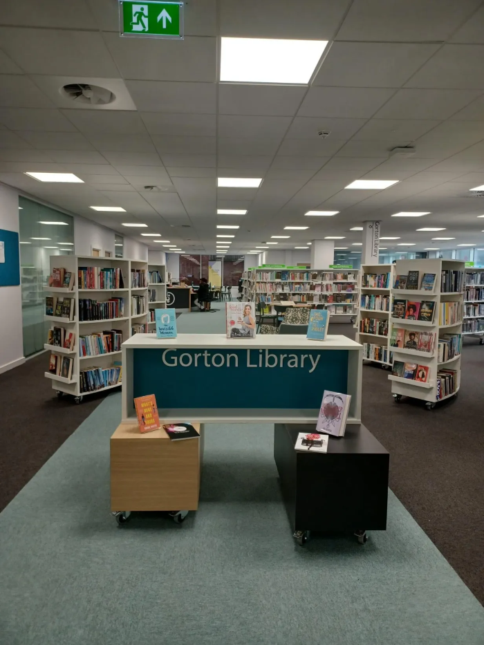 The Gorton Library interior, with a desk and shelves full of books