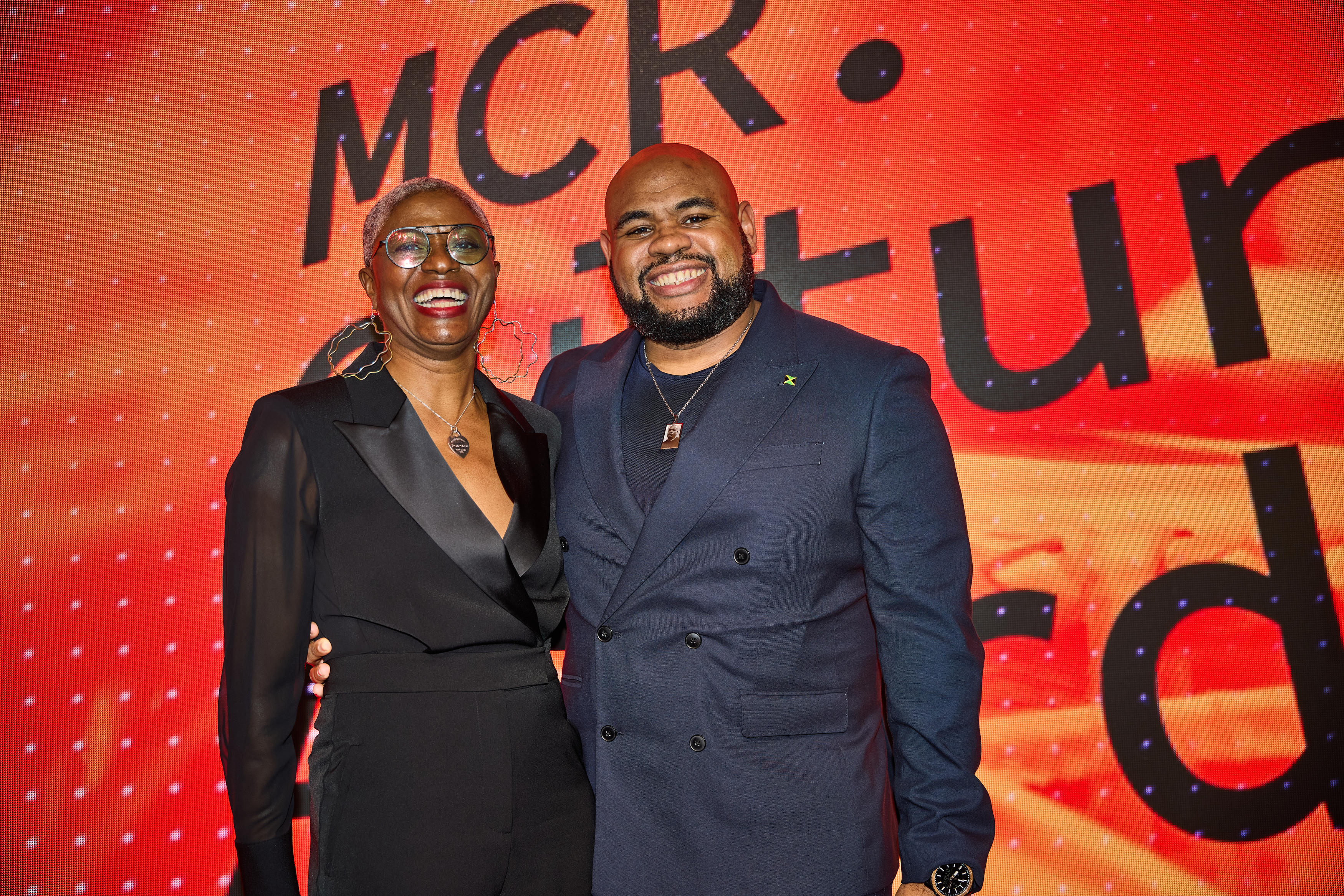 DJ Paulette and Reece Williams hosts of the Manchester Culture Awards 2025 smiling from the stage
