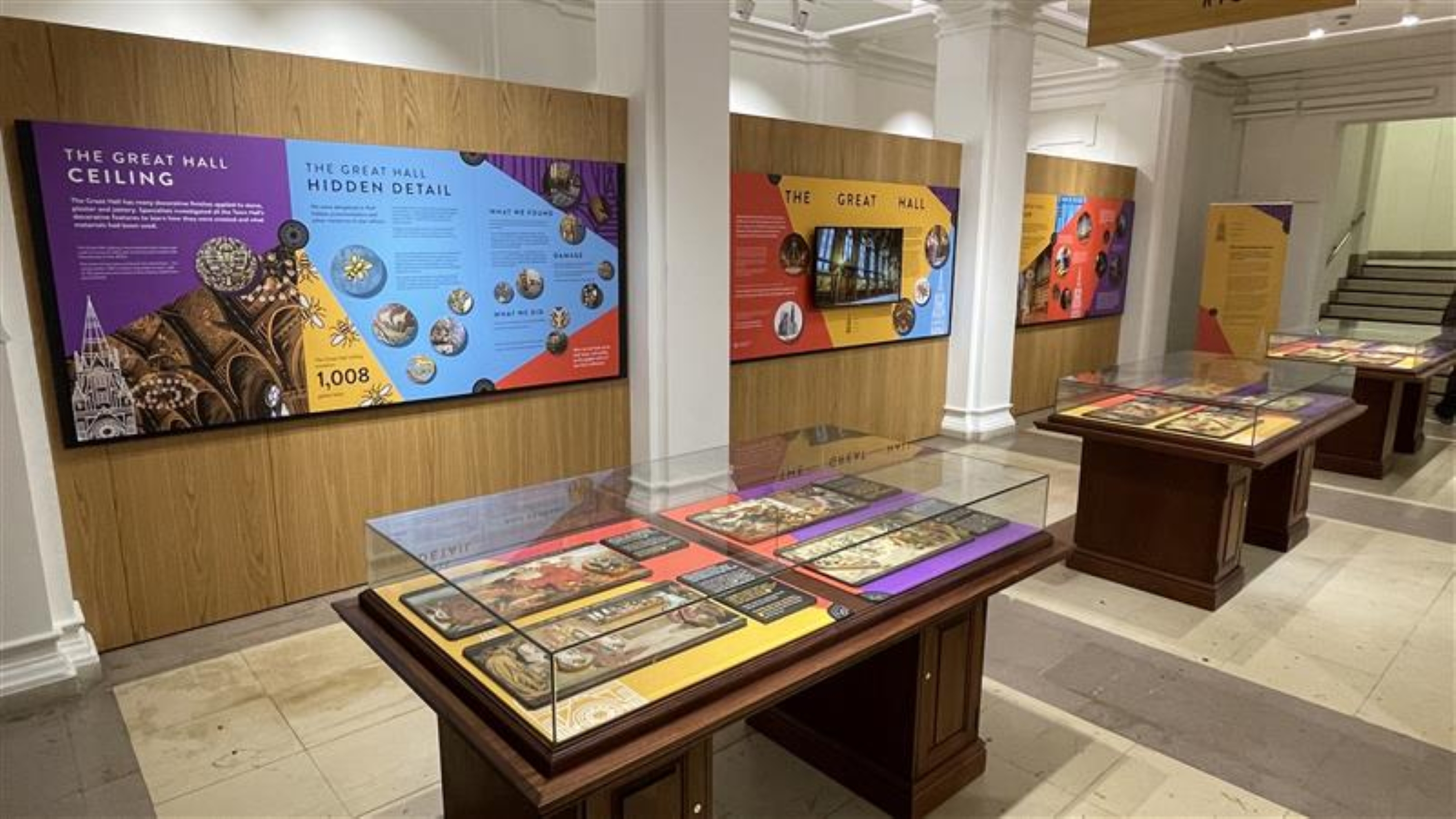 Image shows display boards and cases, dressed with information about the Our Town Hall project's work on Manchester Town Hall's Great Hall 