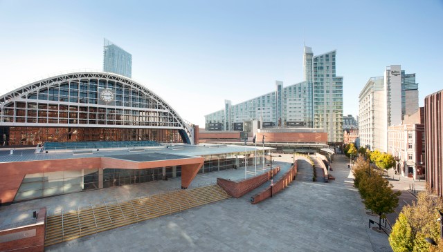 Image of the front of the Manchester Convention centre and the open space outside the entrance