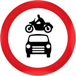 Image shows a sign that restricts motorcycles and cars from an area. A black silhouette of a motorcycle and a car are on a white background, surrounded by a red circle. 