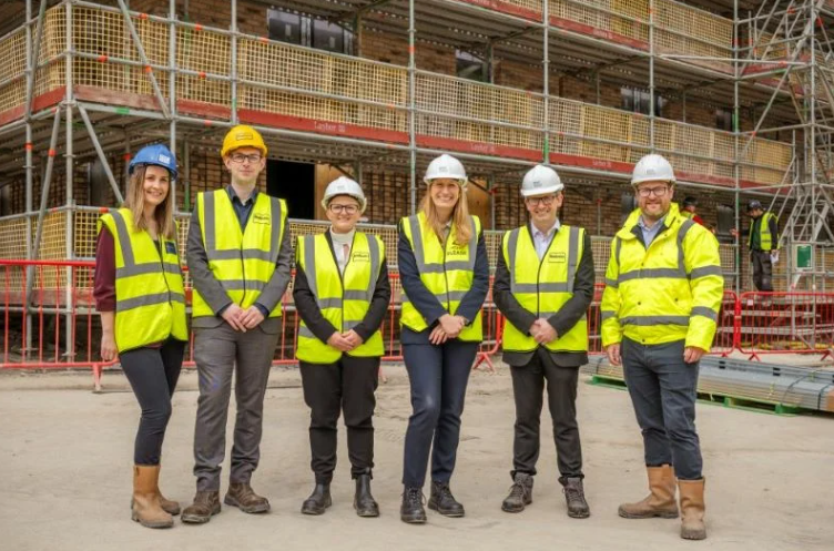 Council Leader and Exec member for housing and development with reps from Great Places at a site in Ancoats