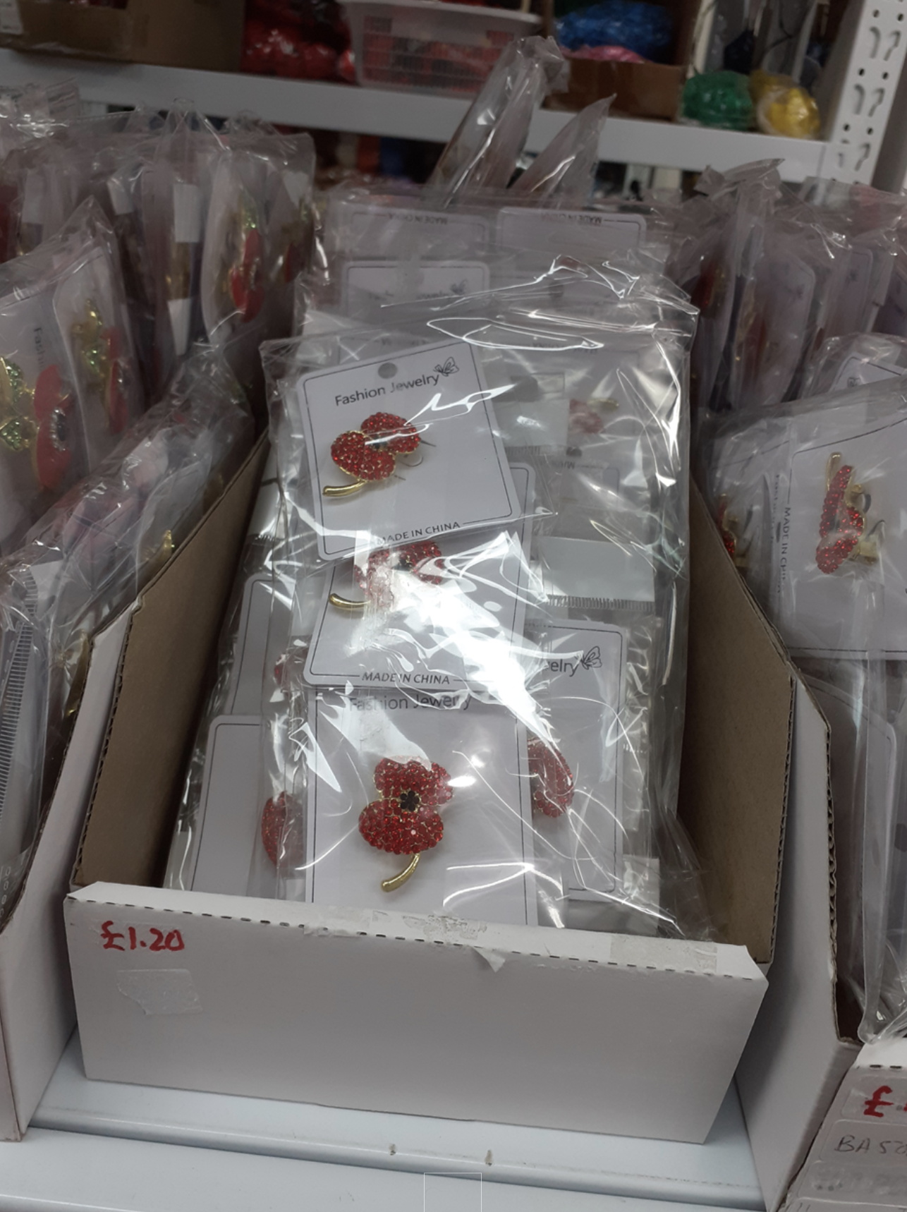 Image of poppy pins in clear plastic packaging.