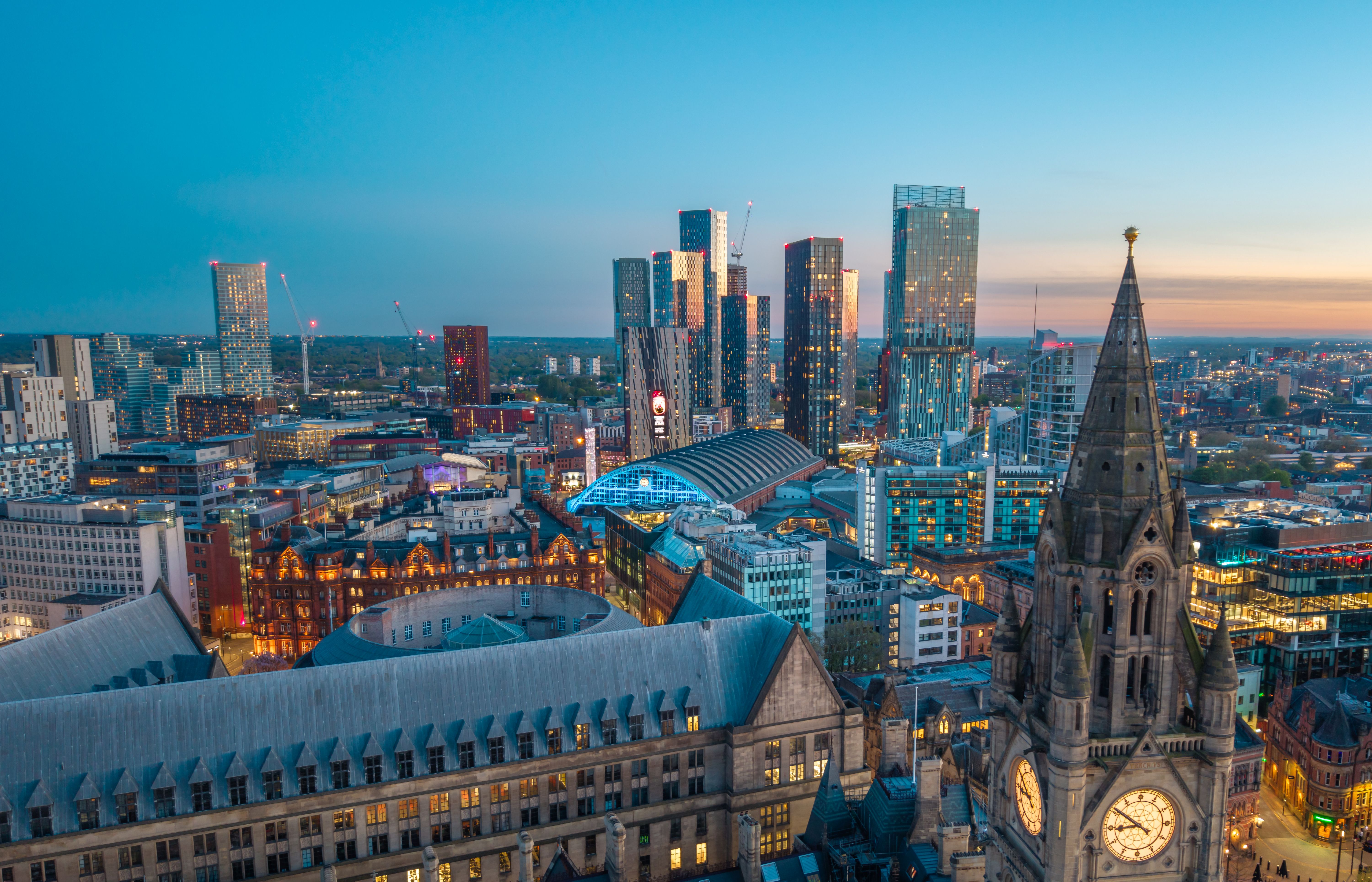 View over city centre rooftops past the Town Hall clock tower