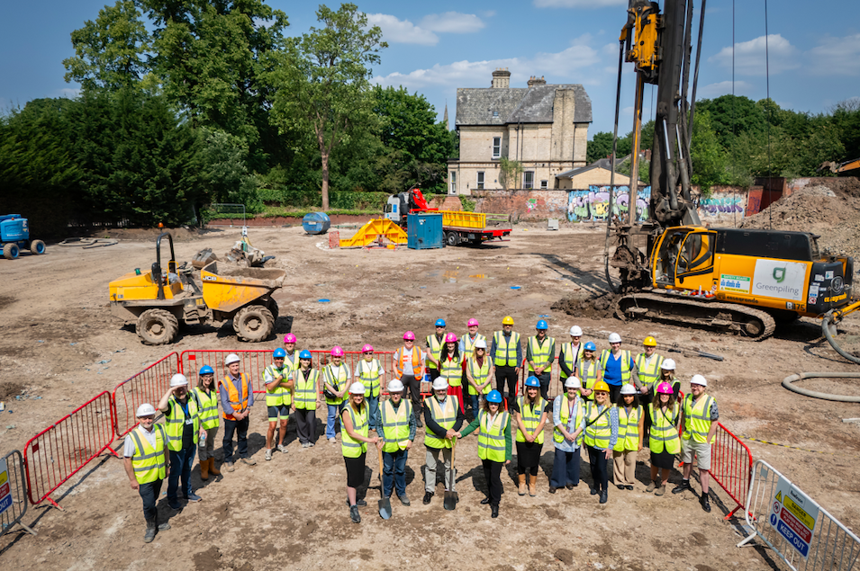 A large group shot of the partnership delivering the new LGBTQ+ extra care homes in Whalley Range