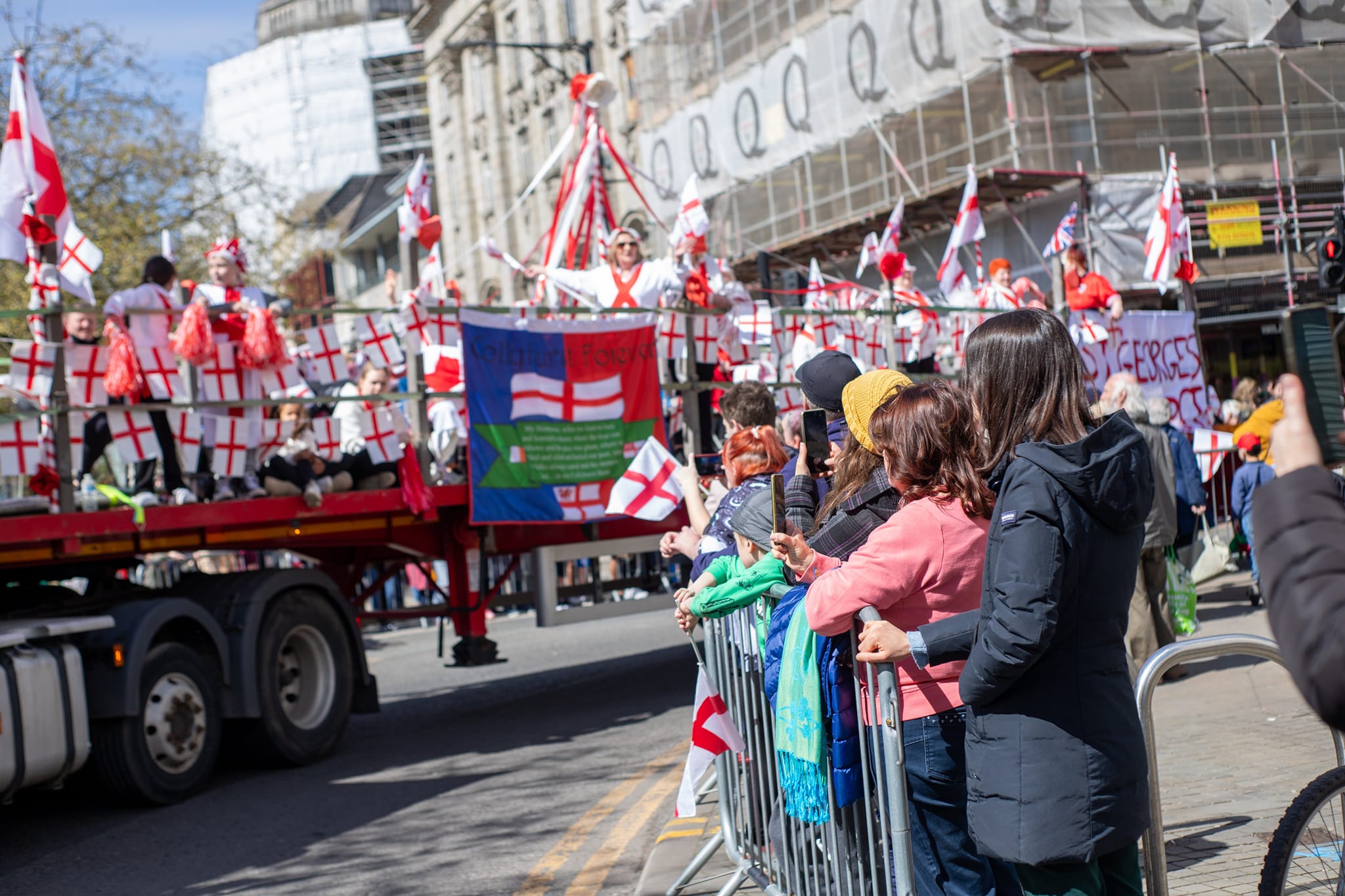 A float makes it way through the crowd for the St George's Day parade