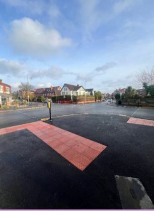 Image showing tactile surface paving at a controlled pedestrian crossing at the junction of Slade Lane / Moseley Road / Albert Road.
