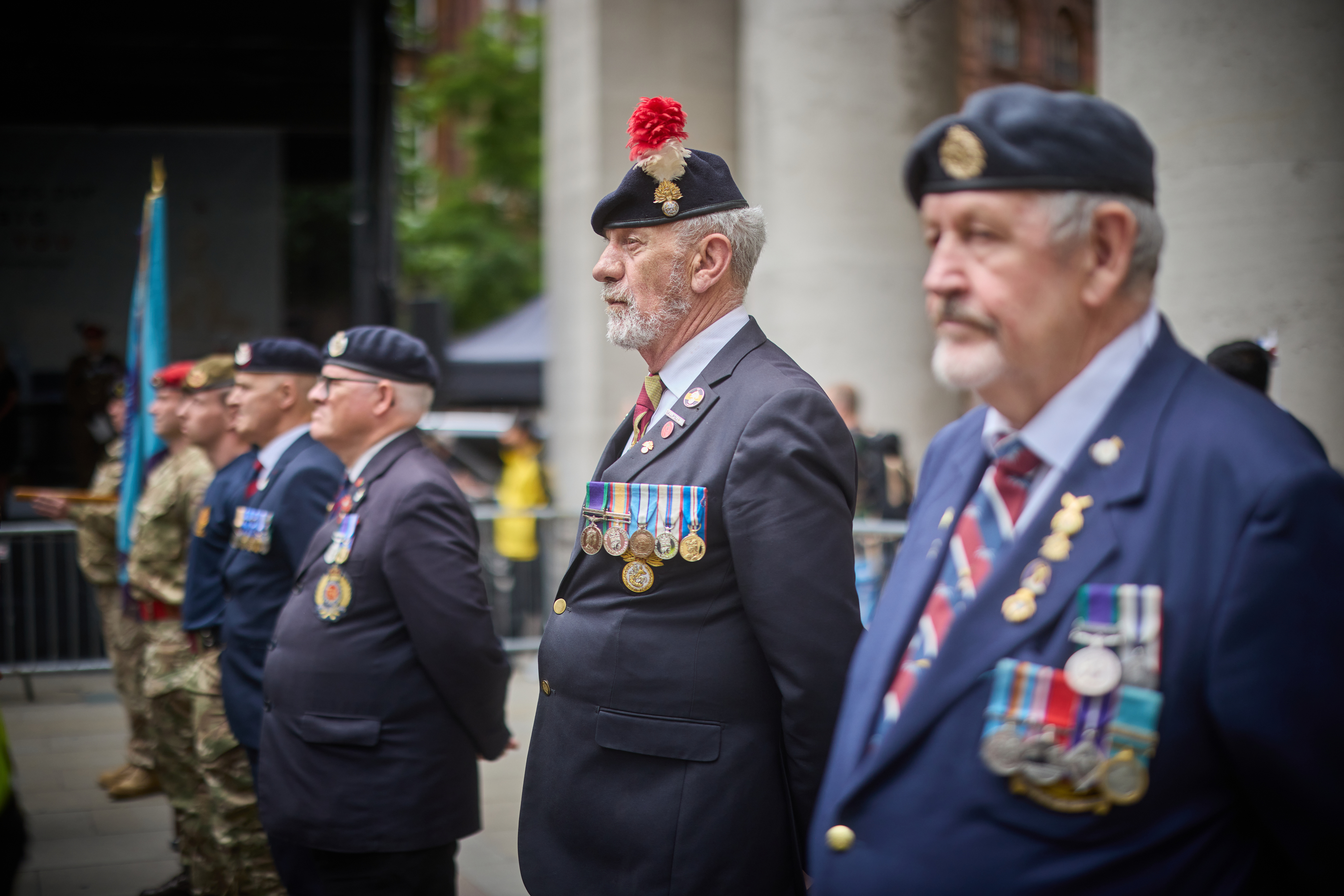 Veternans standing in a line outside Manchester Central library