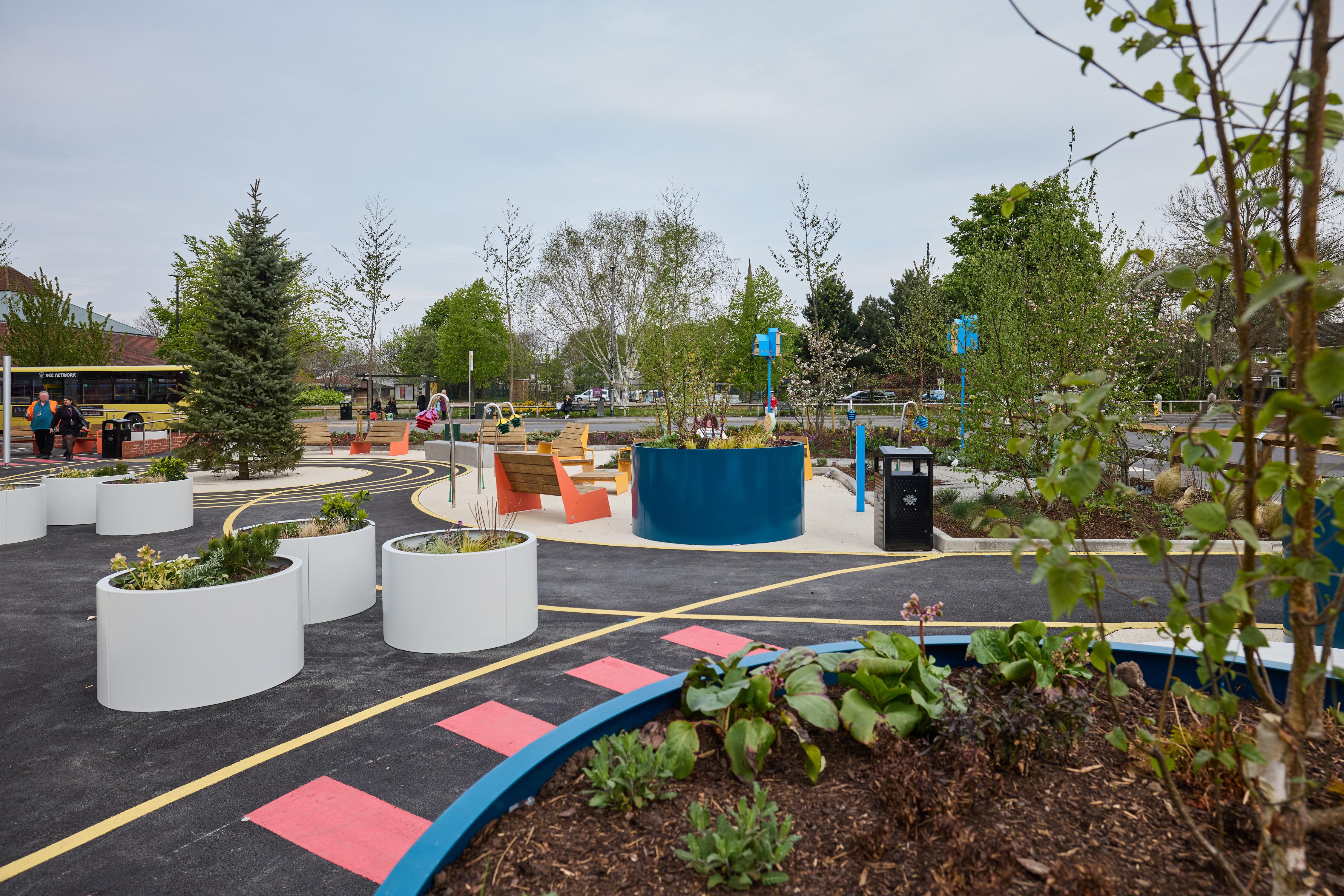 picture of the new square including lots of new planting, seating and play spaces