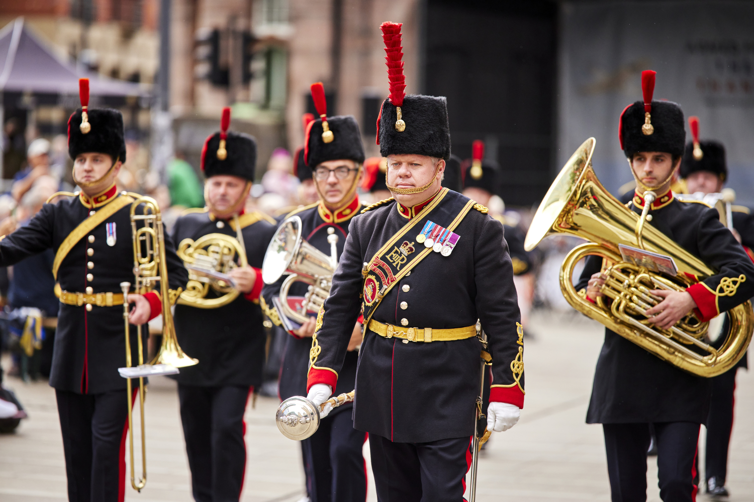 Members of the Armed Forces take part in a parade