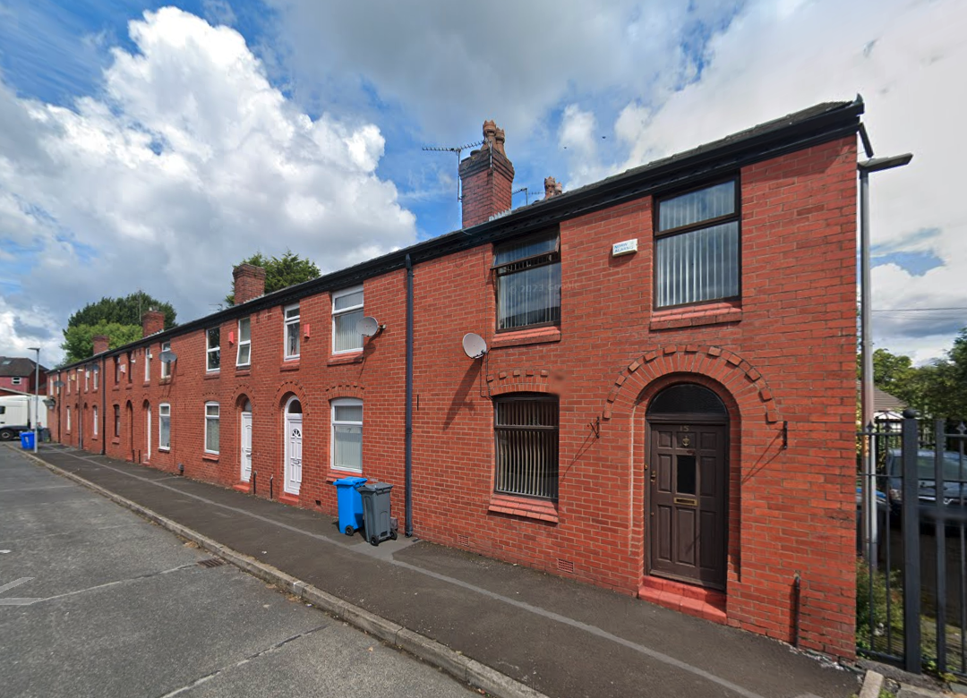 General shot of Whiteway Street in Harpurhey - red brick terraces