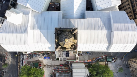 Image of the town hall from a bird's eye top-down view showing it encased in white cladding.