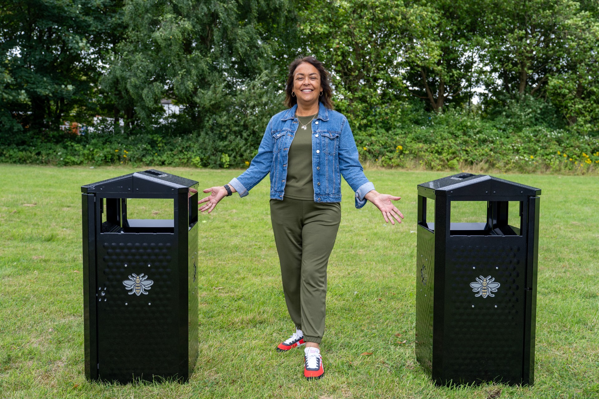 Cllr Lee Ann Igbon alongside two new litter bins