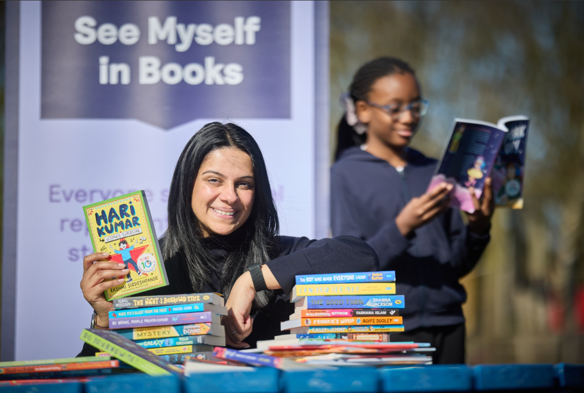 Author Rashmi Sirdespande with a St Saviour's Primary School pupil