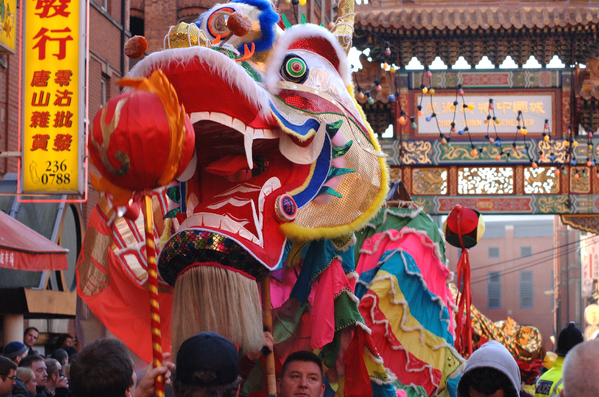 Street scene, a huge colourful Chinese Dragon pictured
