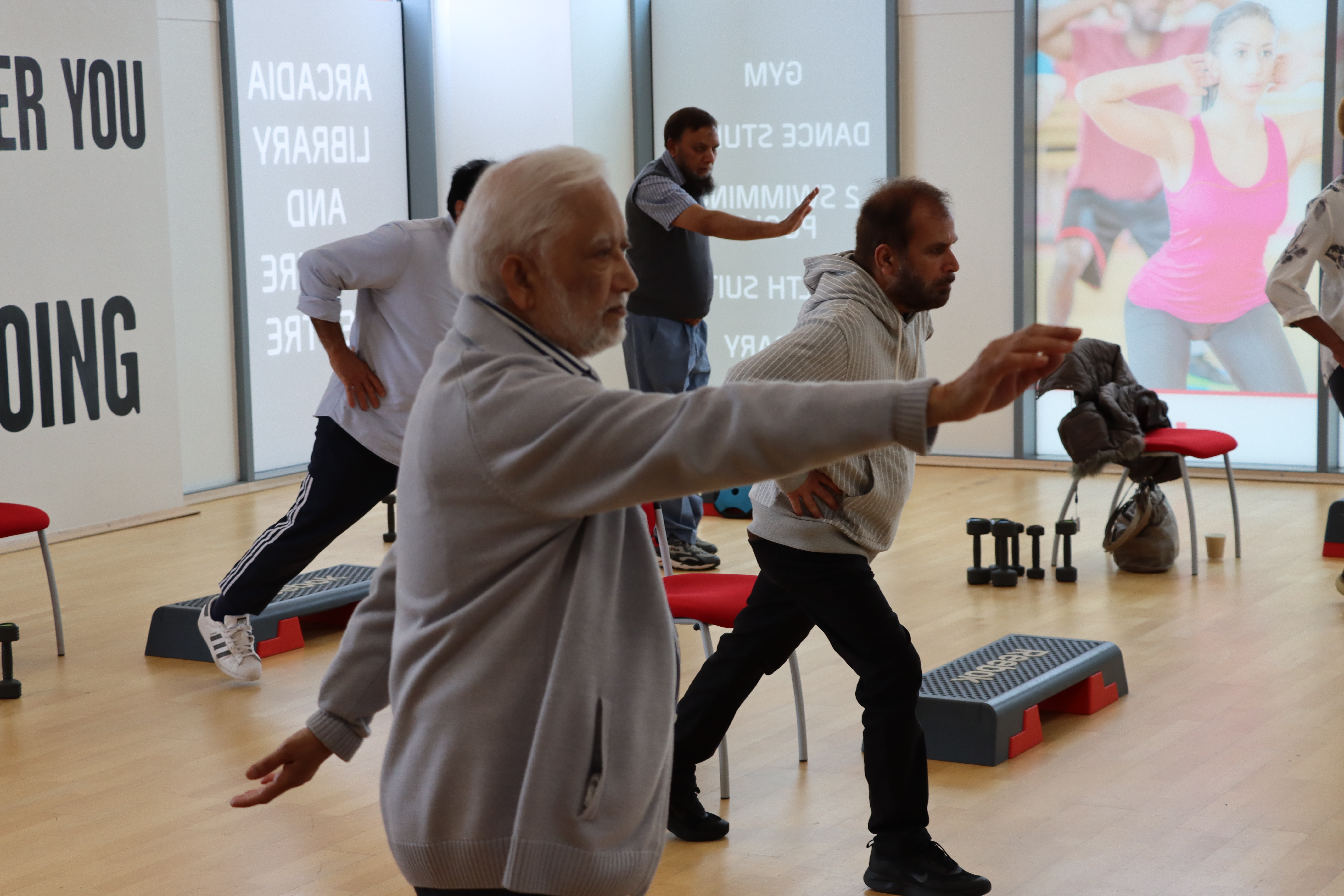 Group of older people at a gym session. Group of older people at a gym session.