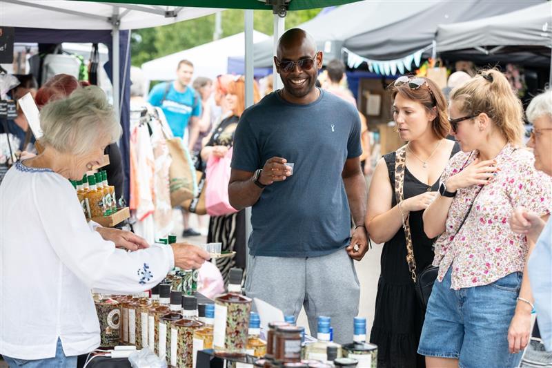 Man shops at market stall