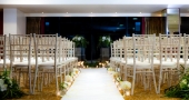 The Manchester Piccadilly Hotel wedding venue with rows of chairs on either side of the isle