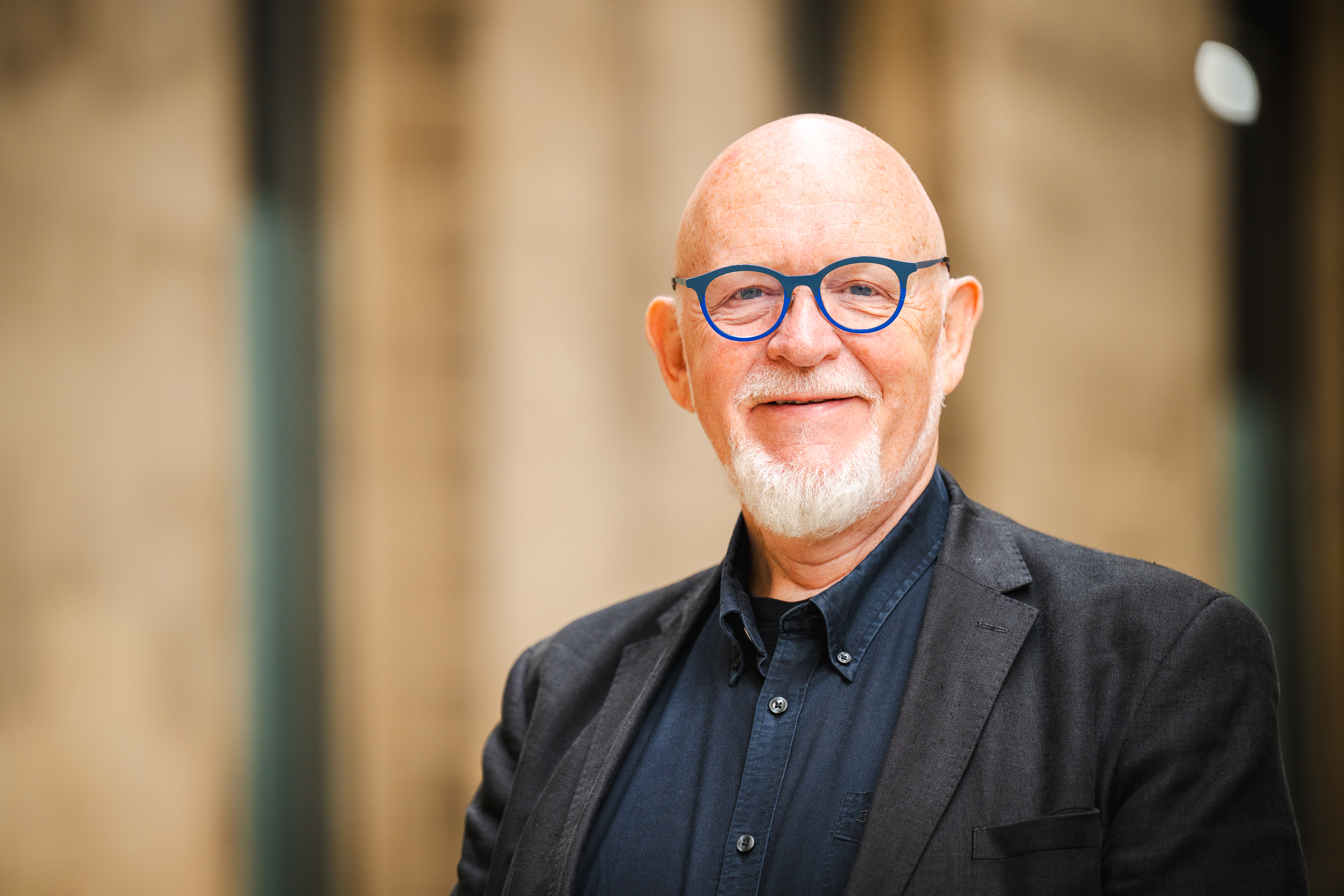 Head and shoulders of a man Dave Moutrey smiling as he looks at the camera