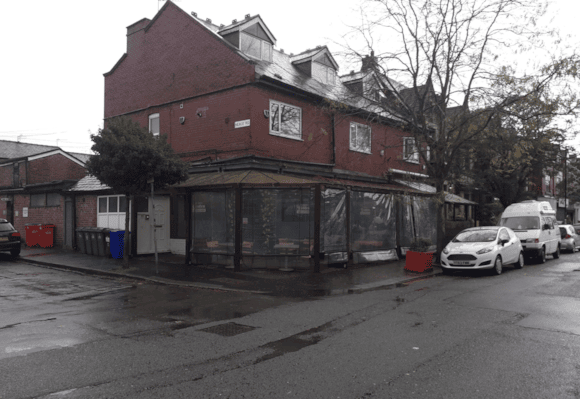Image of the exterior of a business, with a canopy extending around its perimeter.