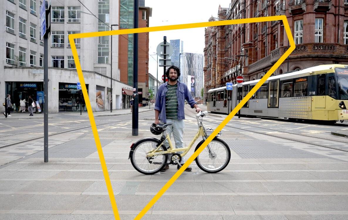 A man stands holding the publicly available MCR bee bikes