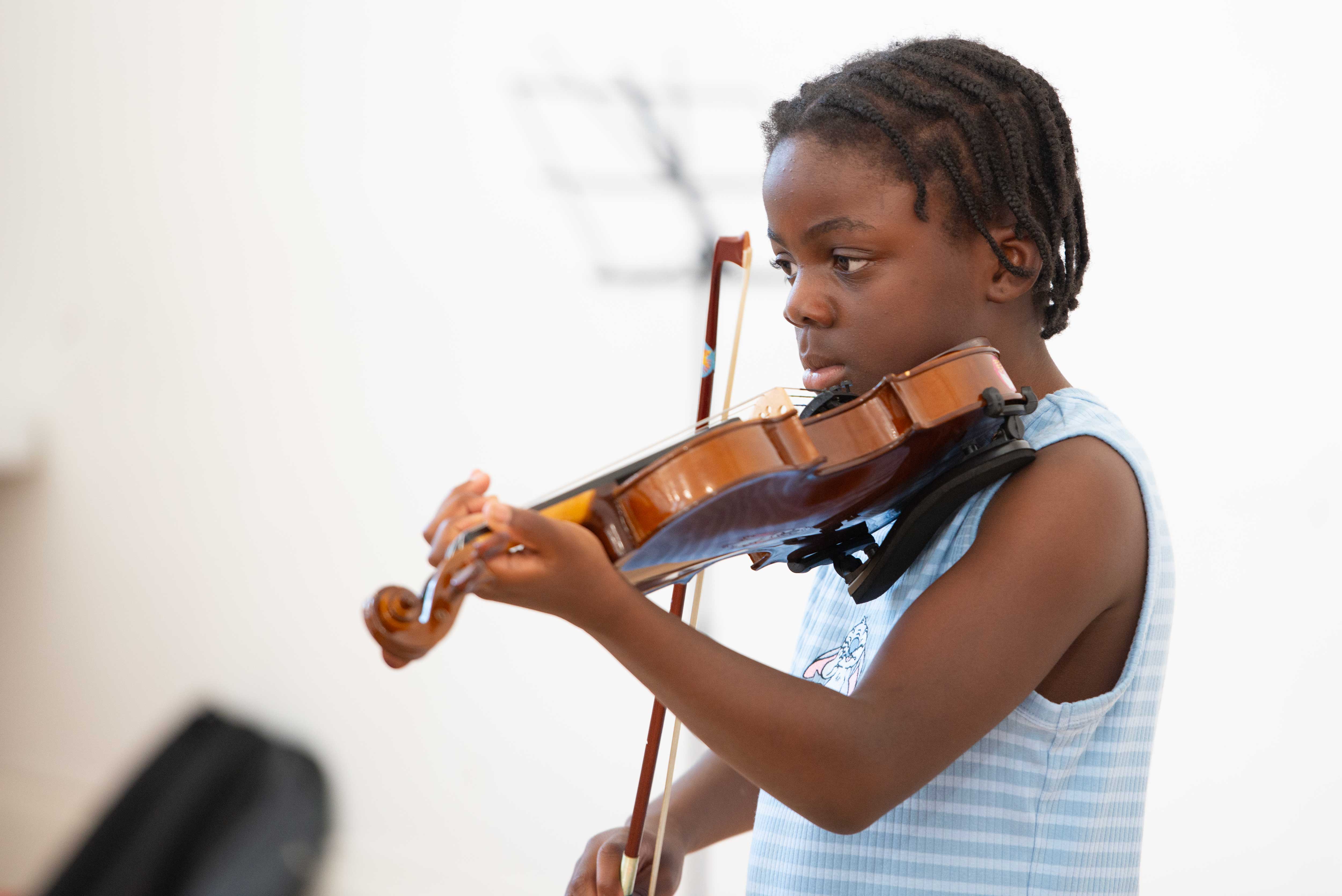 Child playing a violin